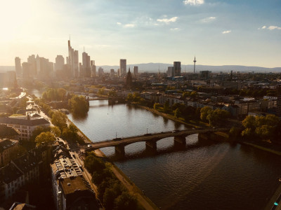 View from above of the Main River in Frankfurt, with the skyline visible in the background.